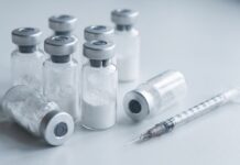 Peptides Are the Question at the Counter. Here’s How to Answer, Merchandise, and Keep the Sale Vials of white lyophilized injectable peptide powder with a syringe, representing unauthorized peptide drugs sold online in Canada