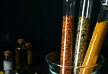 Blood-Sugar Botanicals Have a Dose Problem Turmeric, cinnamon and dried herbs in laboratory test tubes — natural products for blood sugar under the evidence lens